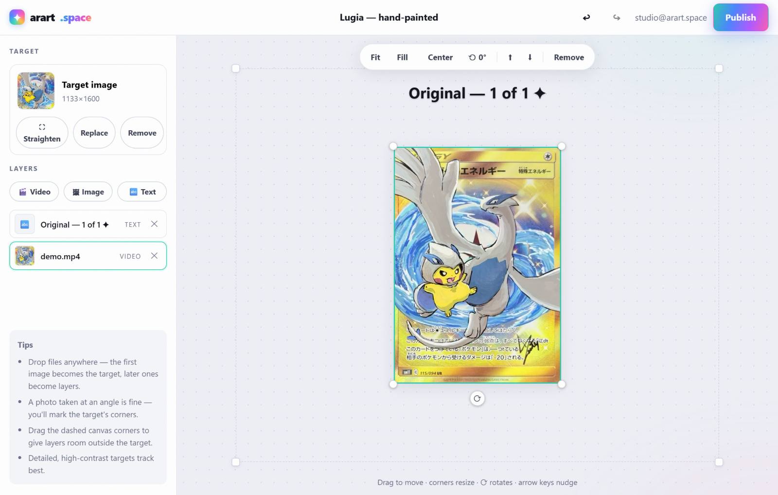The arart.space editor: a trading card as the anchor with a video layer and a text layer composed on top